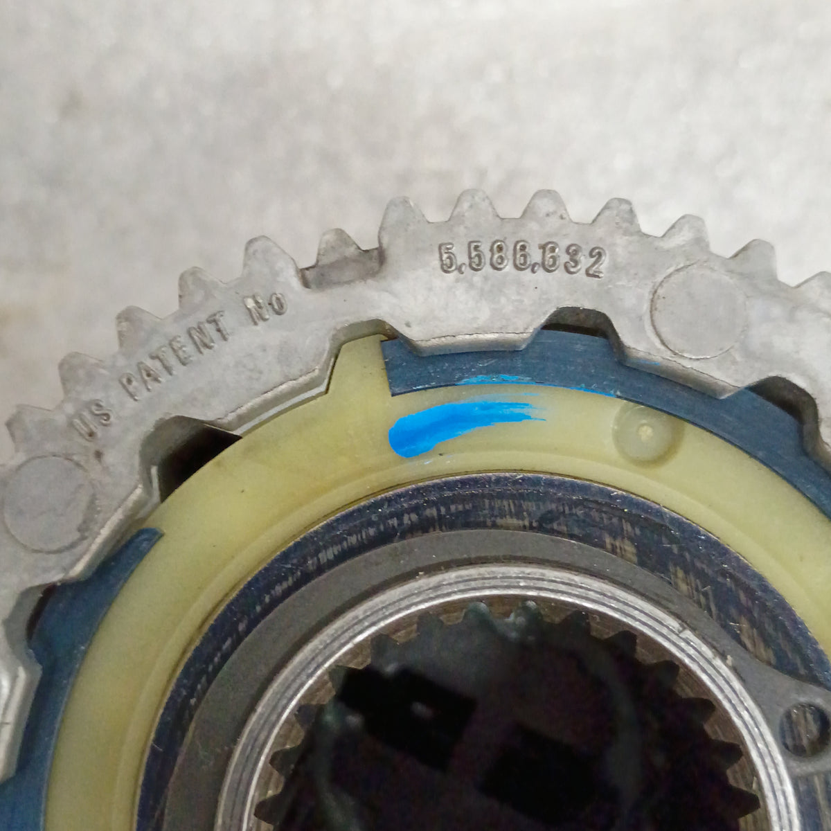Close-up view of a Ford manual locking hub with patent number 5,586,832, featuring a silver finish and blue marking.