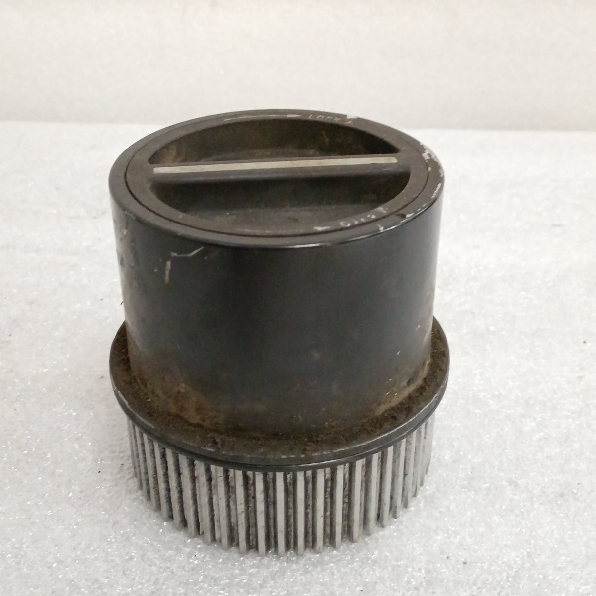 Ford OEM manual locking hub for 1999-2004 F250/F350, used condition, plated metal with silver finish, fits Dana 50/60 axles.