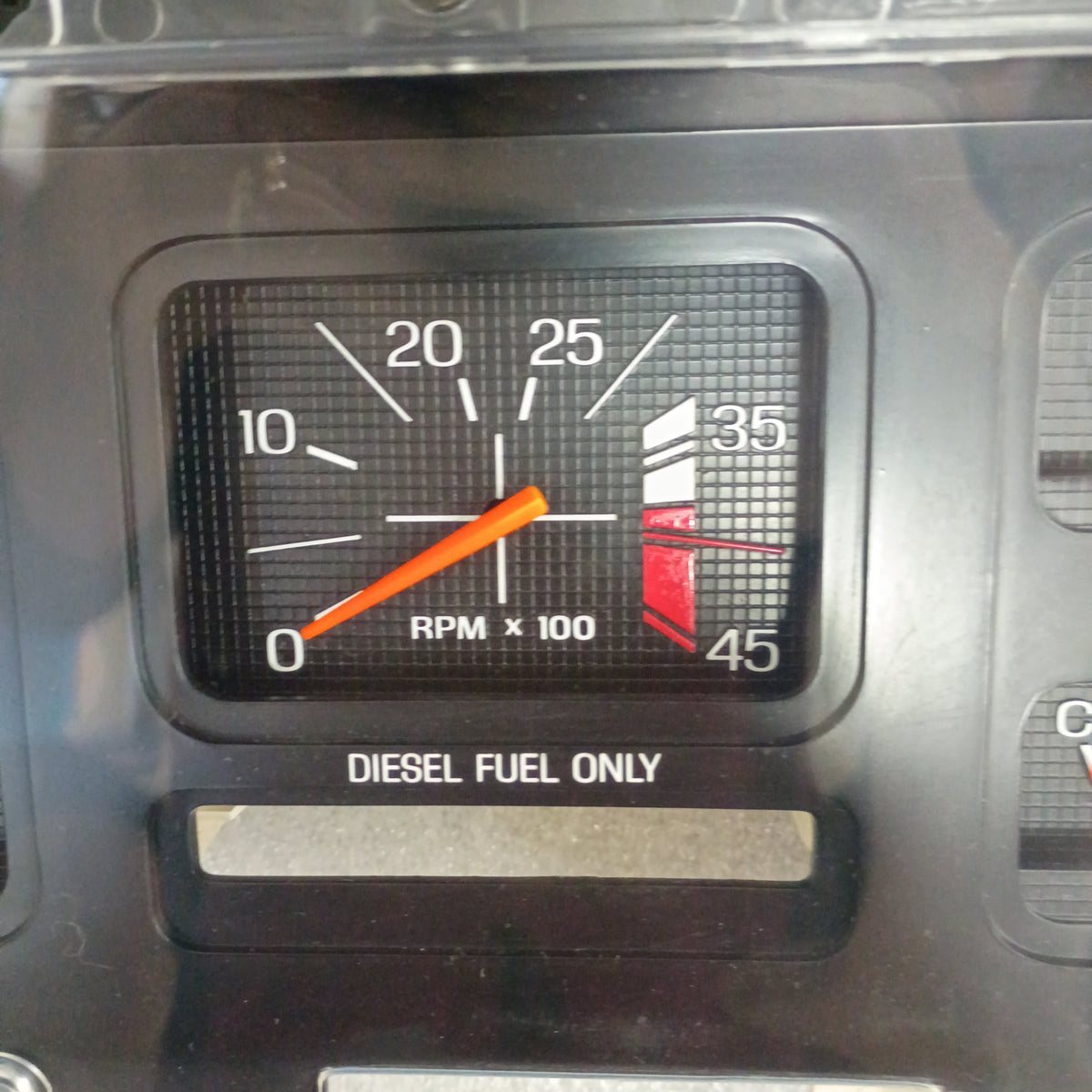 Refurbished Ford truck diesel tachometer gauge reading 0-45 RPM x 100 with 'Diesel Fuel Only' label, excellent condition.