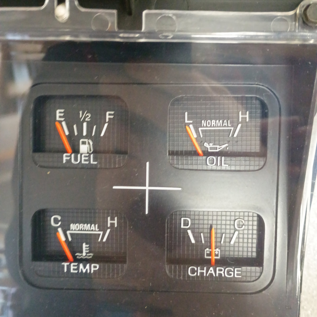 Refurbished Ford gauge cluster with fuel, oil, temp, and charge meters for 1980-1986 F-Series and Bronco trucks.