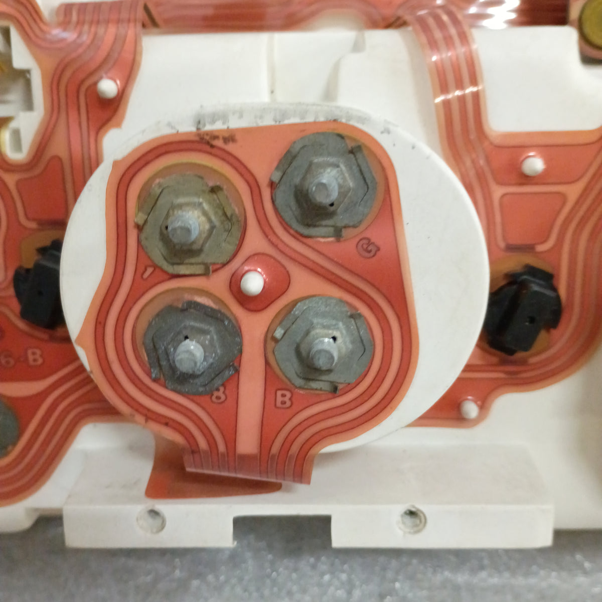 Close-up of refurbished Ford truck diesel gauge cluster with visible circuitry and connectors, suited for 1980-1986 models.