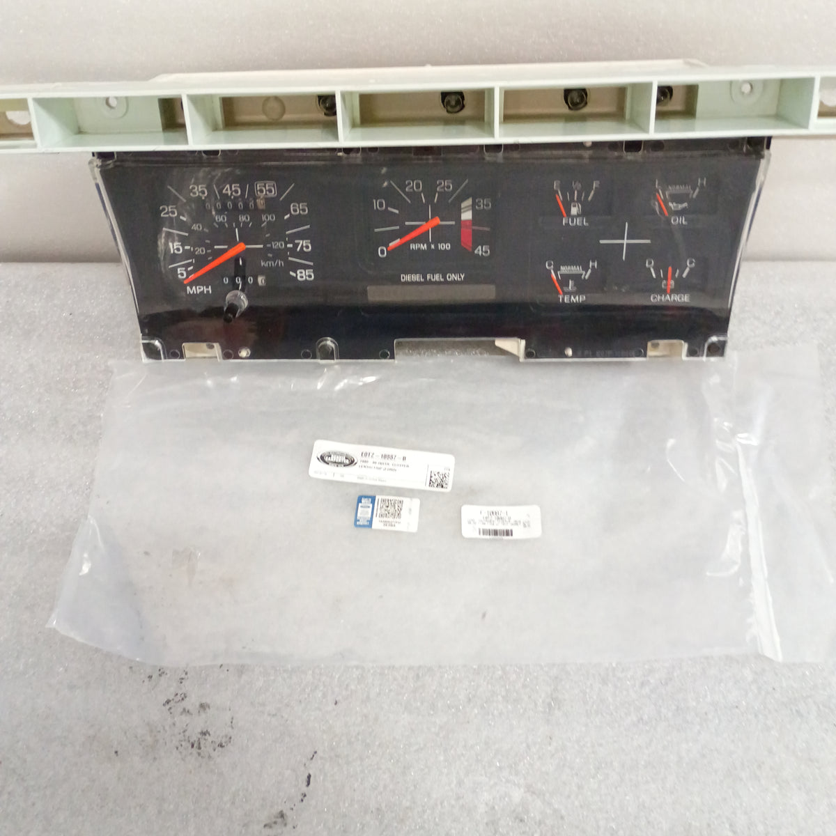 Refurbished diesel gauge cluster with tachometer for 1980-1986 Ford trucks and Bronco. Includes new Dennis Carpenter lens.