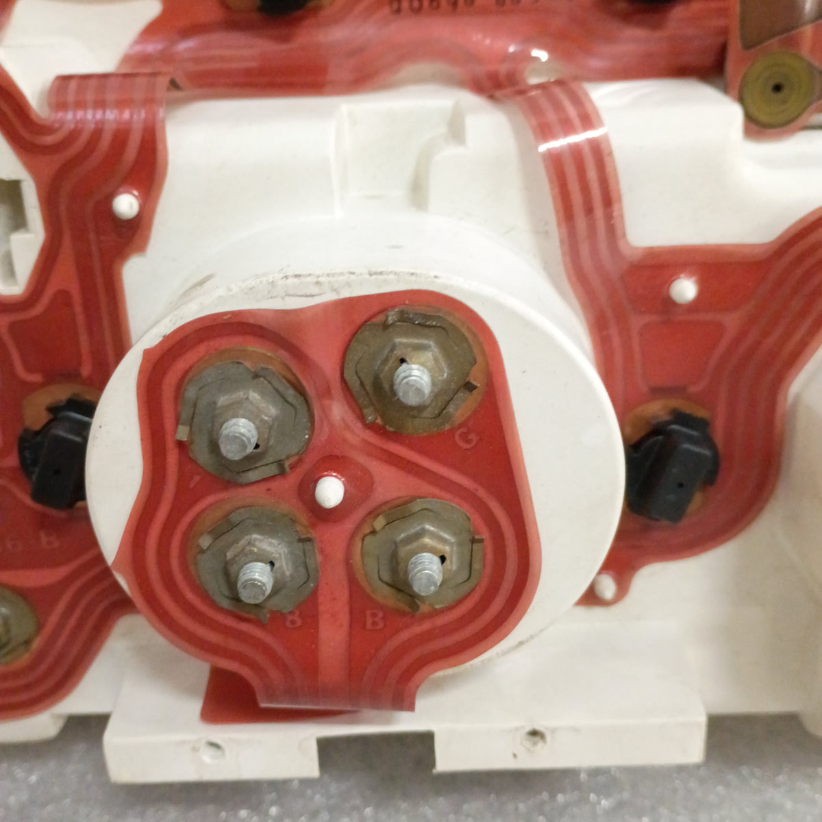 Back view of a refurbished Ford truck gauge cluster circuit board, showing connections and red wiring for 1980-86 models.