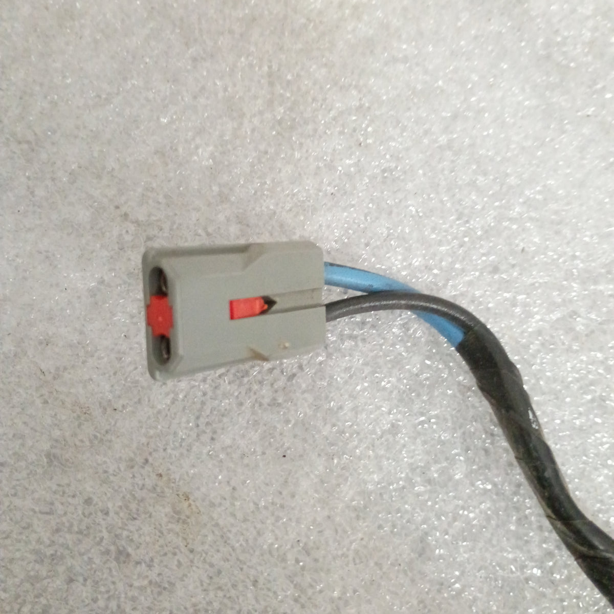 Gray and red connector with blue and black wires for Ford power window and door lock wire harness. Compatible with 1987-1991 F-Series and Bronco.