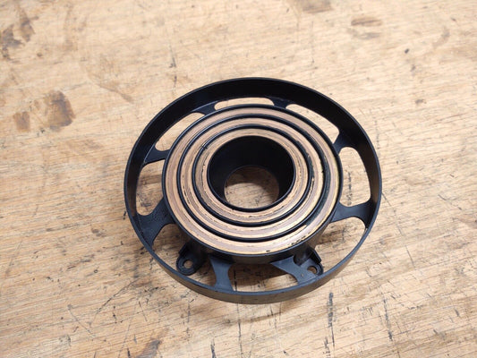 OEM Ford steering wheel clock spring contact ring showing concentric copper contact traces inside a black plastic circular housing, compatible with 1992-1997 Ford F-150, F-250, F-350, and Bronco.