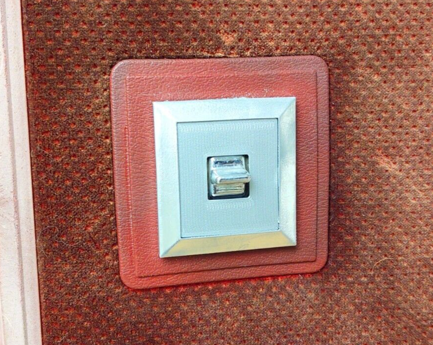 Red textured power window switch bezel with a silver inner trim and chrome switch, compatible with 1980-1986 Ford F-150, F-250, F-350, and Bronco passenger side doors.
