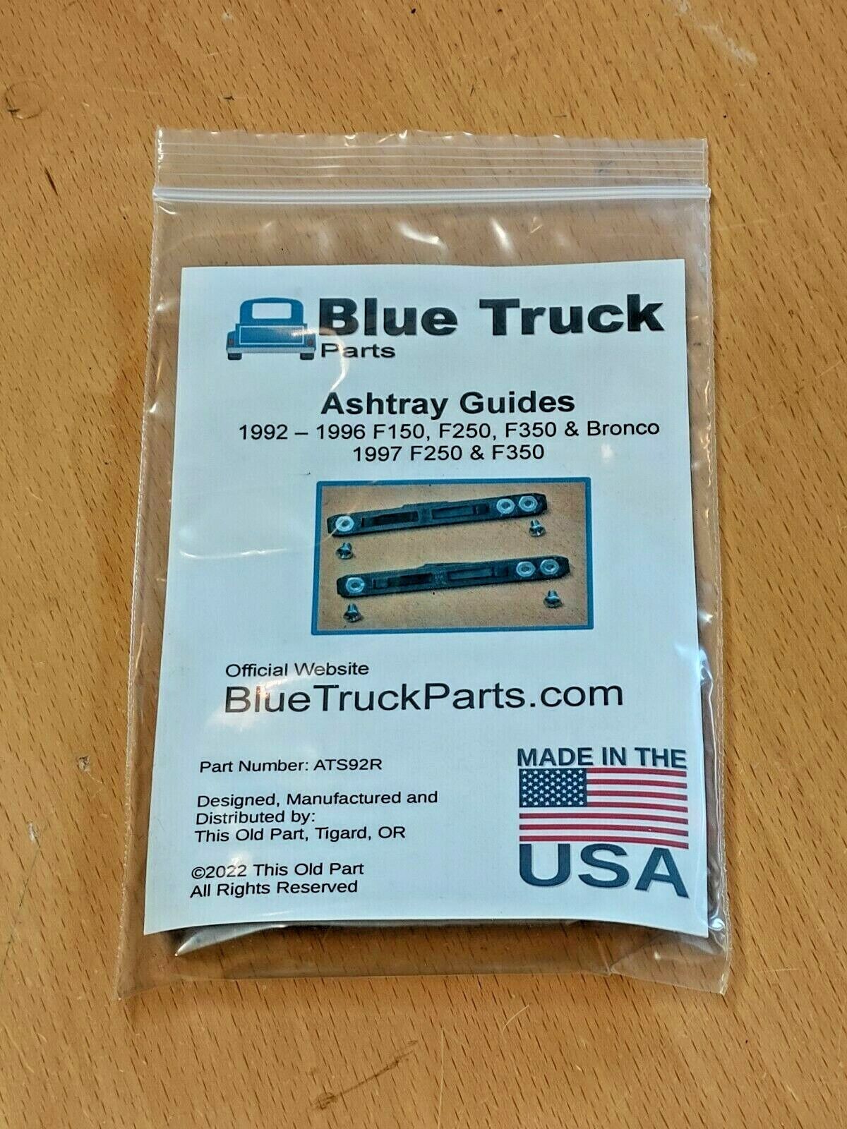 Blue Truck Parts packaged set of Ashtray Guides (Part ATS92R) for 1992-1997 Ford F150, F250, F350, and Bronco, in a clear ziplock bag with a white product information insert.