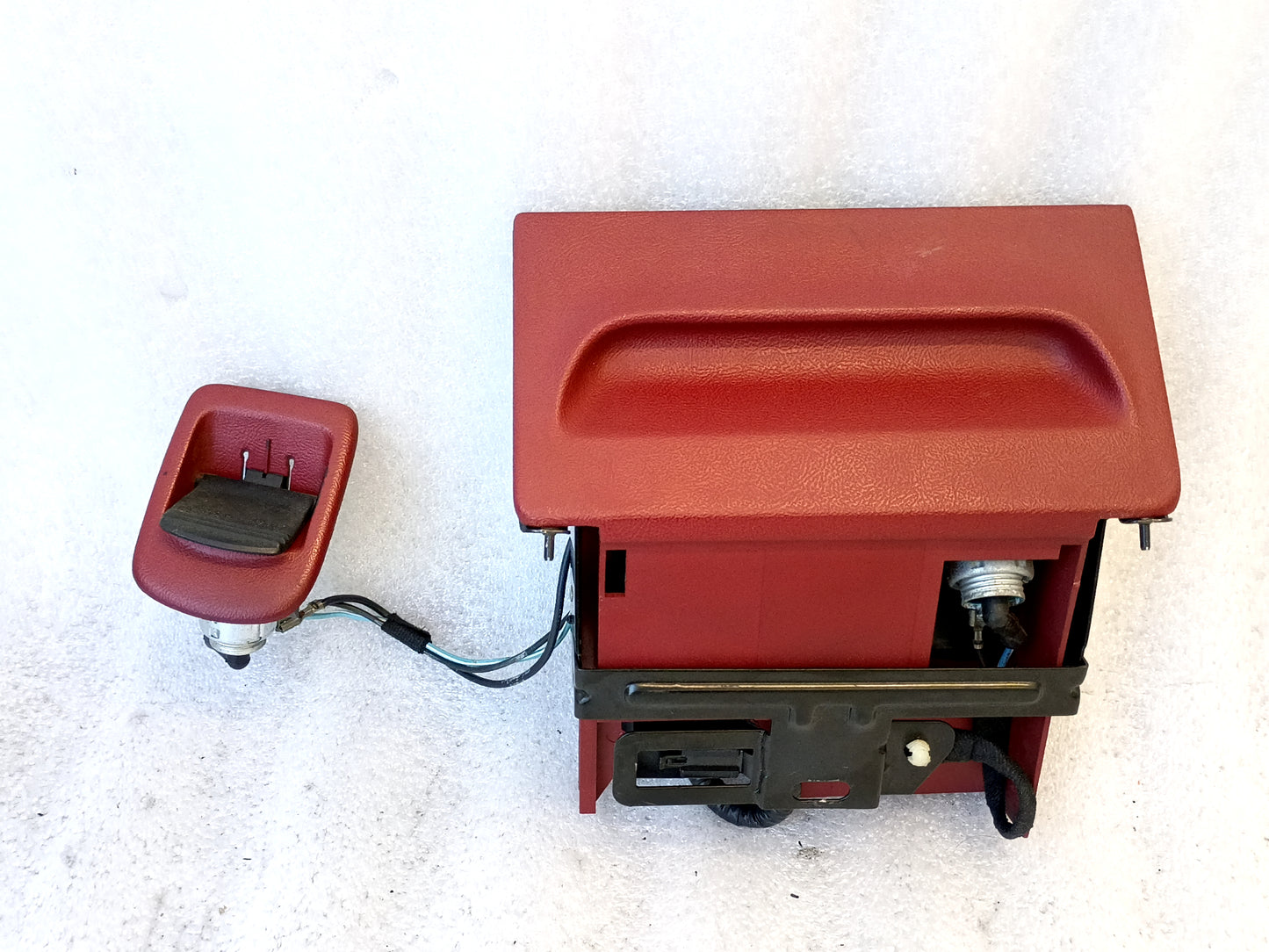 Red ashtray assembly with power port and wire harness for 1992-1996 Ford F150, F250, F350, and Bronco.