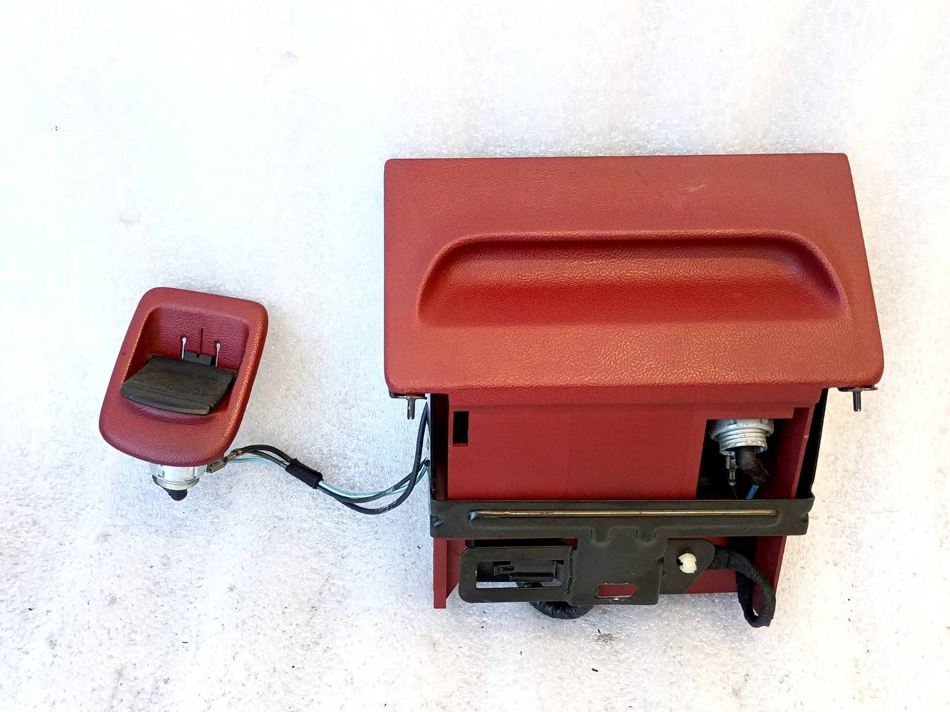 Red ashtray assembly with power port and wire harness for 1992-1996 Ford F150, F250, F350, and Bronco.