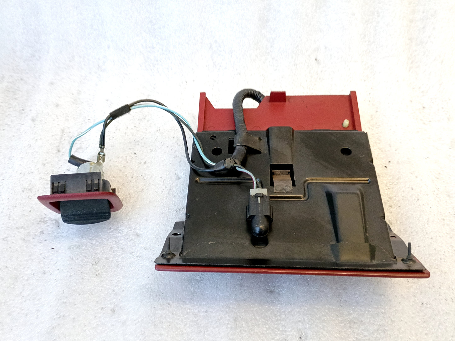 Red and black ashtray assembly with wiring harness for 1992-1996 Ford F-150, F-250, F-350, Bronco; includes power port.