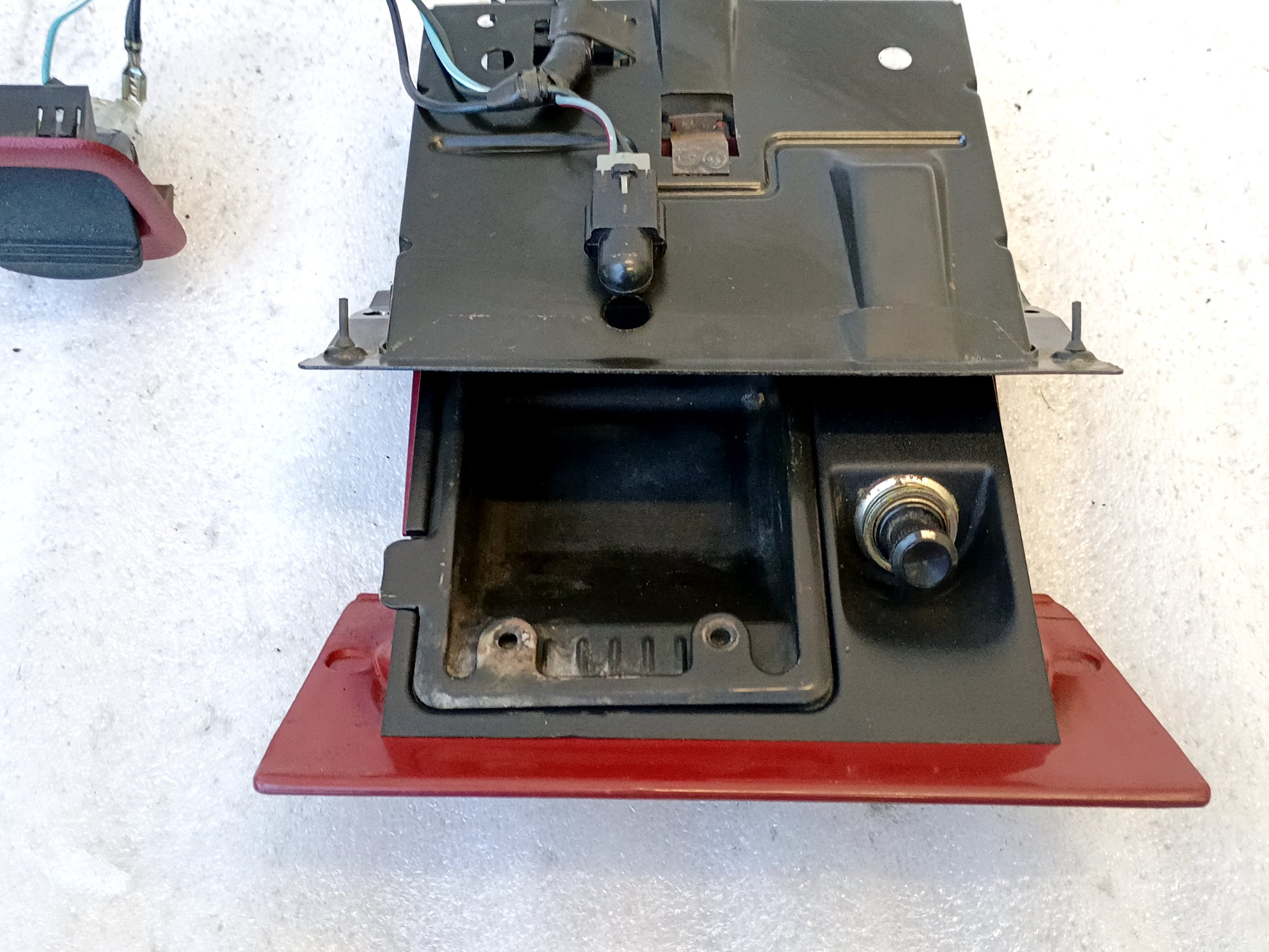 Refurbished red ashtray assembly with mounting bracket and power port for 1992-1996 Ford F150, F250, F350, Bronco.