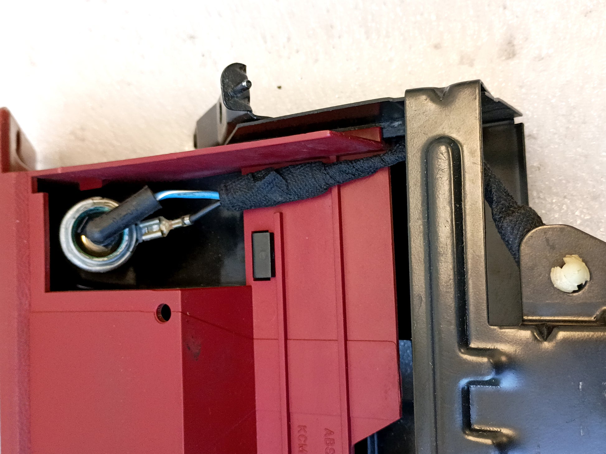 Scarlet red ashtray assembly for 1992-1996 Ford F150, F250, F350, and Bronco with mounting bracket and power port.