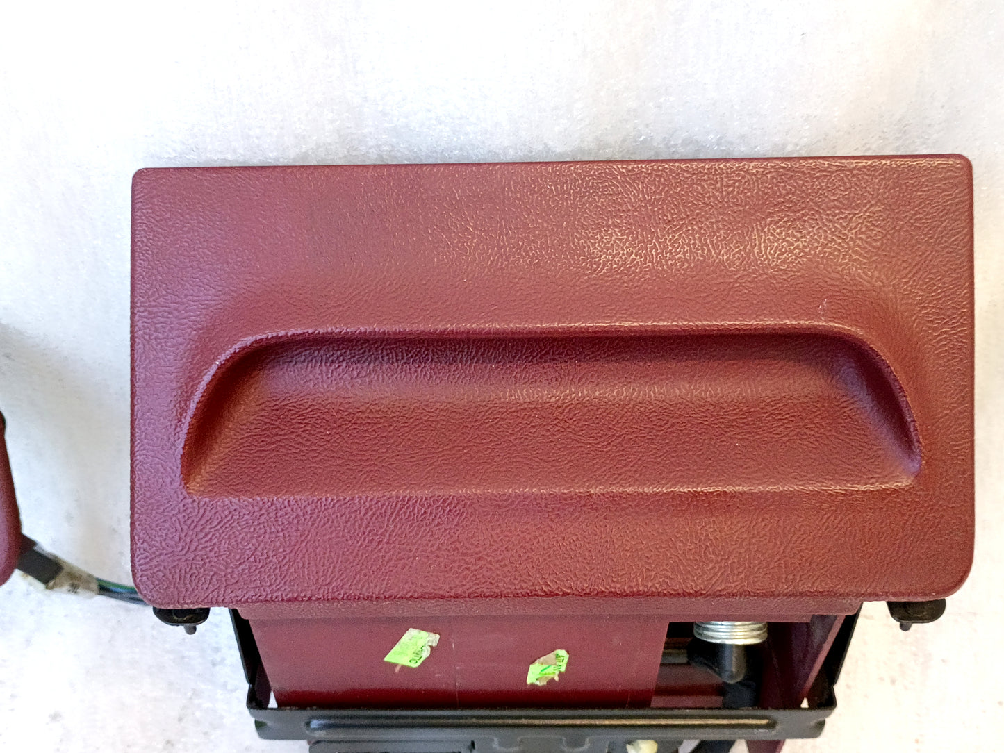 Refurbished dark ruby red ashtray assembly for 1992-1996 Ford F-150/250/350 and Bronco with mounting bracket and wire harness.