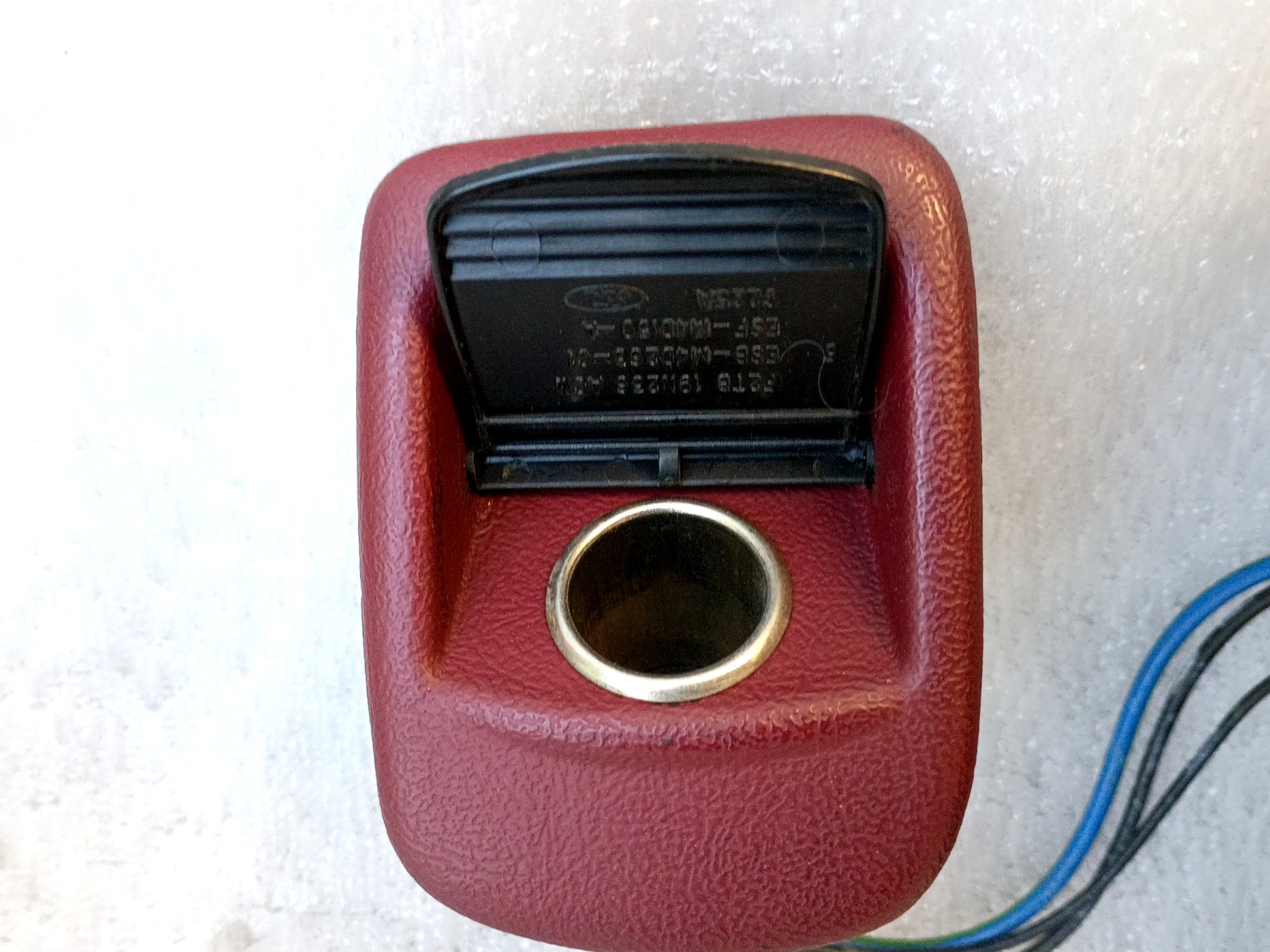 Refurbished dark ruby red Ford ashtray assembly with power port and wire harness, compatible with 1992-1996 F-series and Bronco.