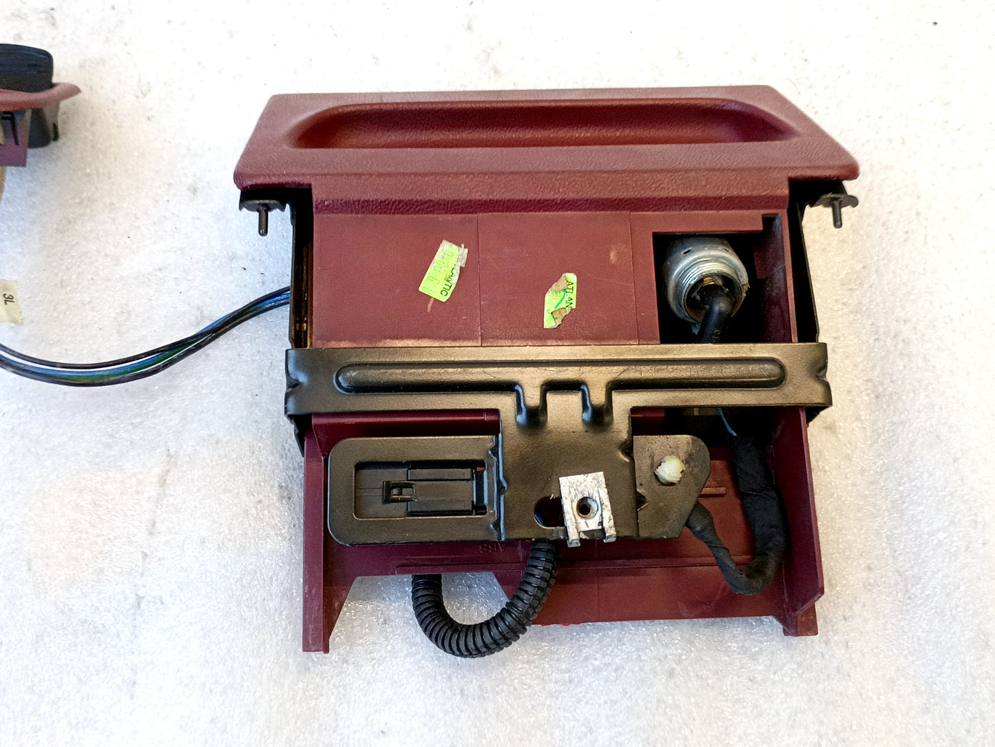 Refurbished dark/red ashtray assembly with mounting bracket, power port, and wire harness for 1992-1996 Ford trucks.
