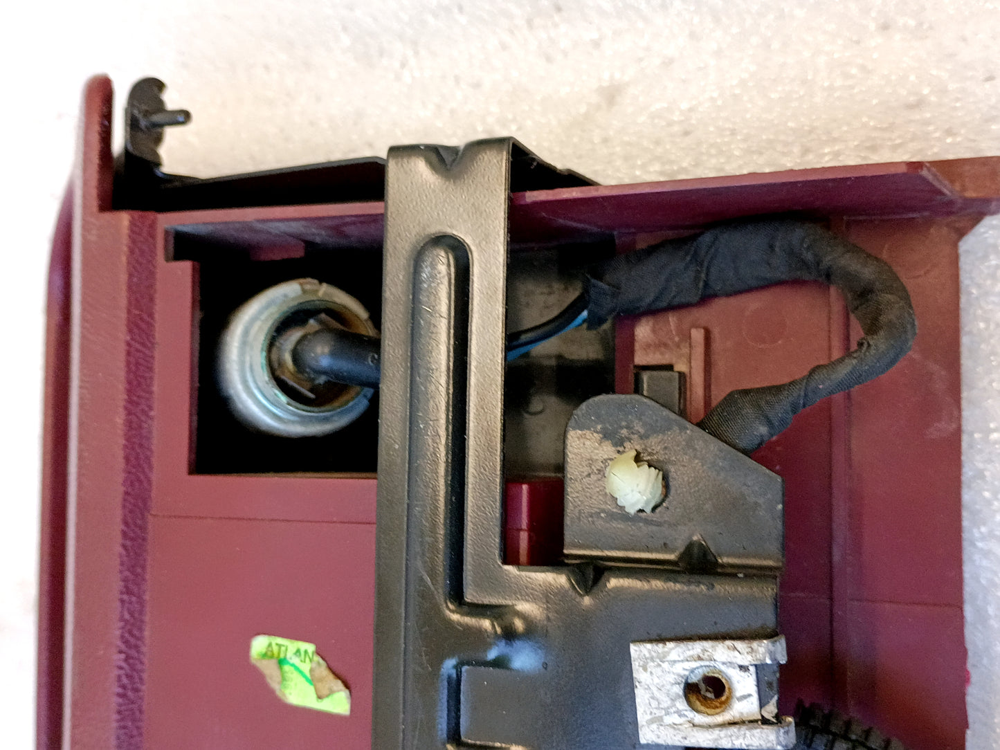 Refurbished dark/ruby red ashtray assembly for 92-96 Ford F150/F250/F350/Bronco with mounting bracket and power port.