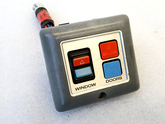 Light gray power door switch with tan bezel, including lock and unlock buttons, fits 80s Ford models like Ranger and Bronco II.