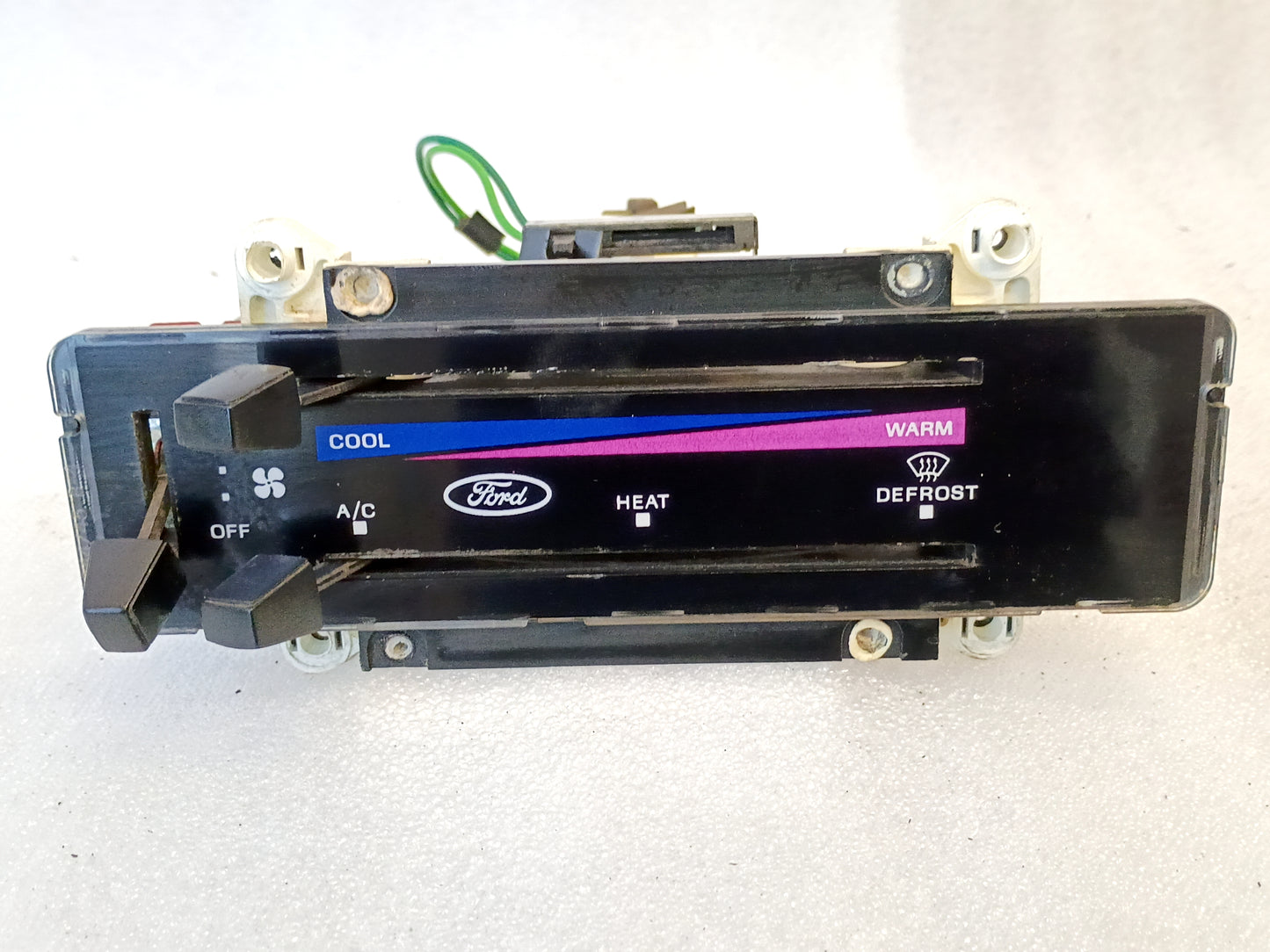 Ford OEM heater and AC control panel with colored triangle temperature indicators for 1980-1986 F-Series and Bronco.