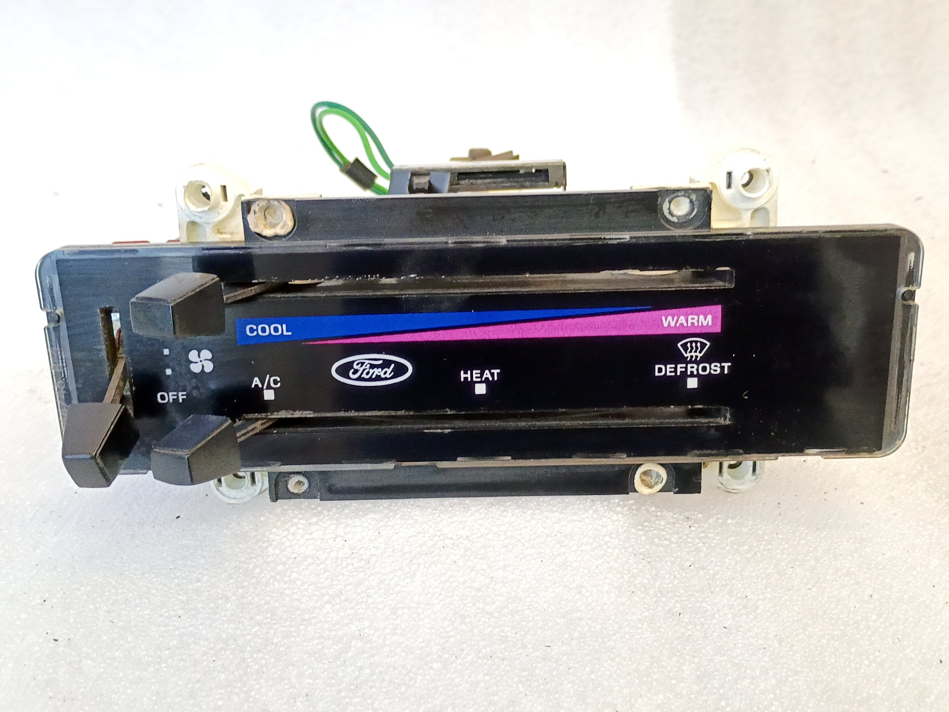 Ford OEM heater and AC control panel with colored triangle temperature indicators for 1980-1986 F-Series and Bronco.