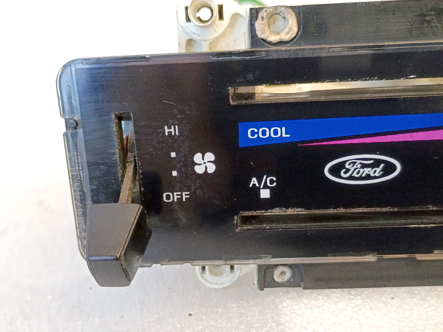 Ford F-Series and Bronco AC and heater control panel with fan and temperature sliders, featuring AC and cool labels.