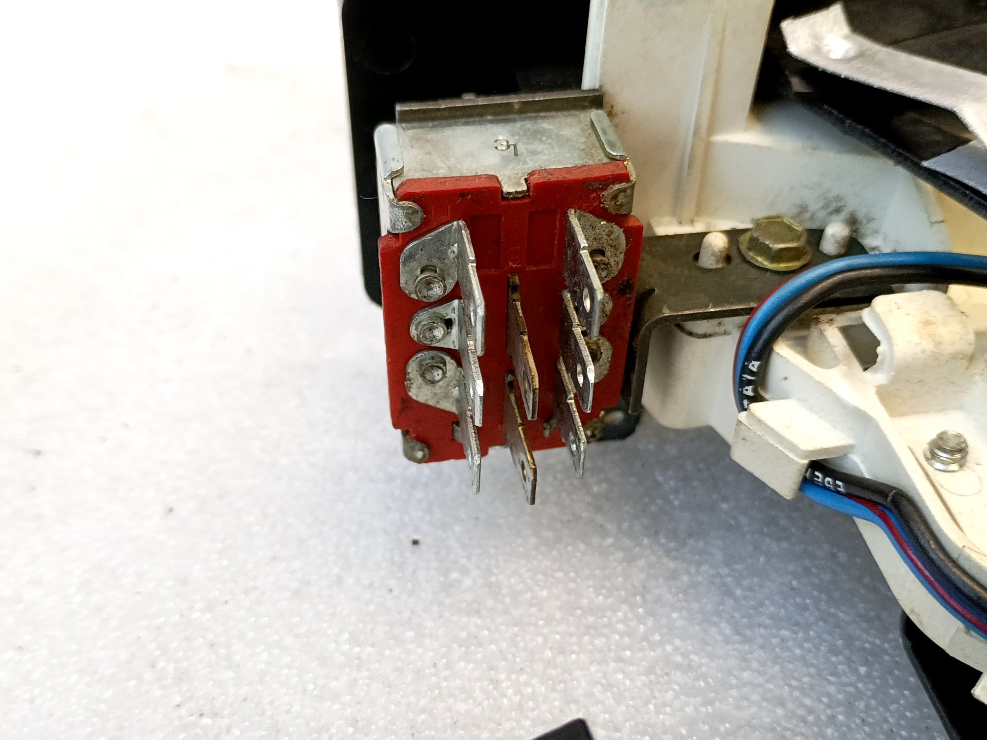 Close-up of dealer-installed AC and heater control component for Ford F-Series and Bronco, showing wiring and connectors.