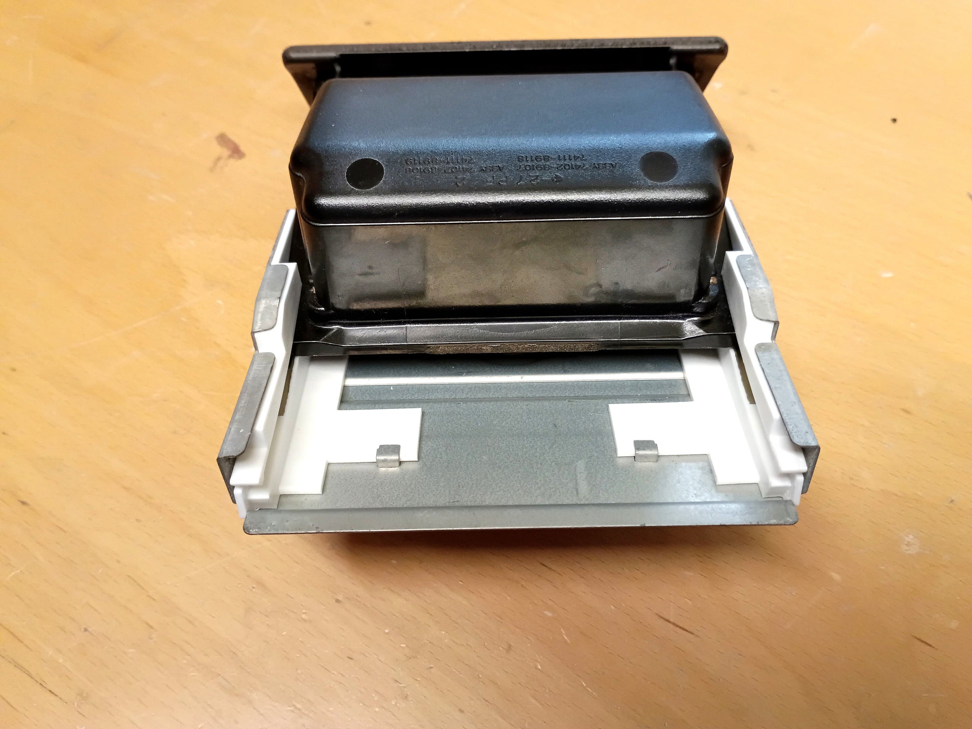 Blue Truck Parts ashtray guide set for Toyota vehicles, metal bracket with white plastic guides.