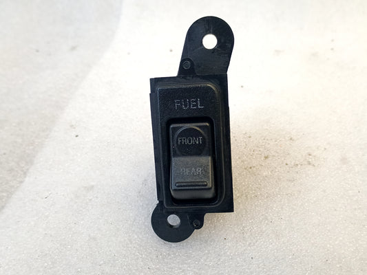 OEM Ford fuel tank switch for 1992-1997 F150, F250, F350, Bronco; dash mount, part number F2TB-9A050-AB.