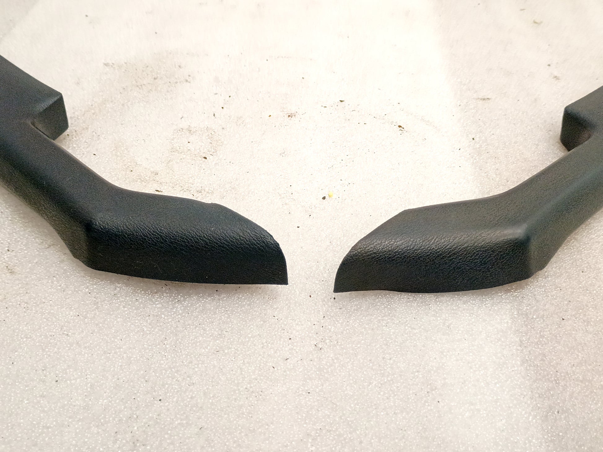 Dark Harbor Blue arm rest set for 1980-1986 Ford F150-F350 and Bronco. OEM parts, textured black finish, left and right pieces.