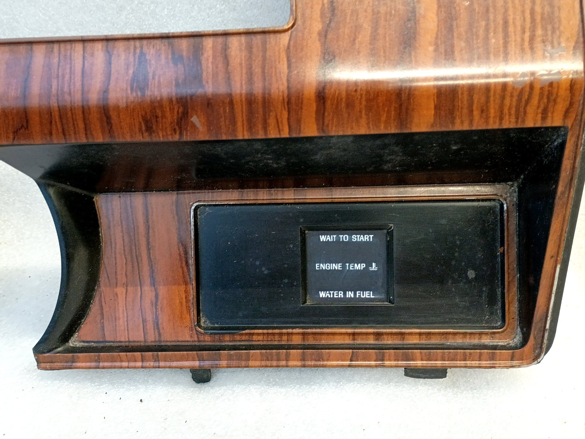 Rose Wood gauge cluster bezel for Ford F250/F350 (1980-1984) with diesel indicator lights.