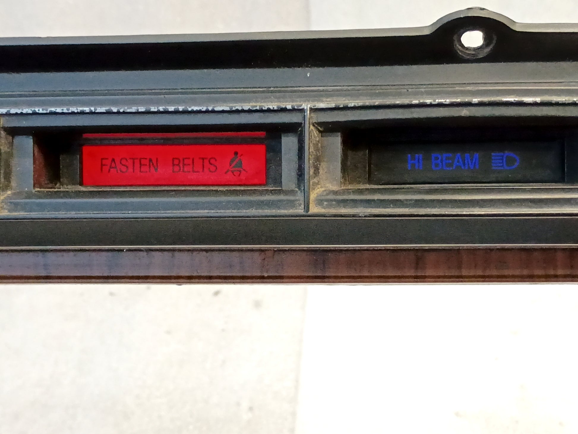Rose Wood gauge cluster bezel for Ford F250/F350, with "Fasten Belts" and "Hi Beam" lights, diesel indicator corner.