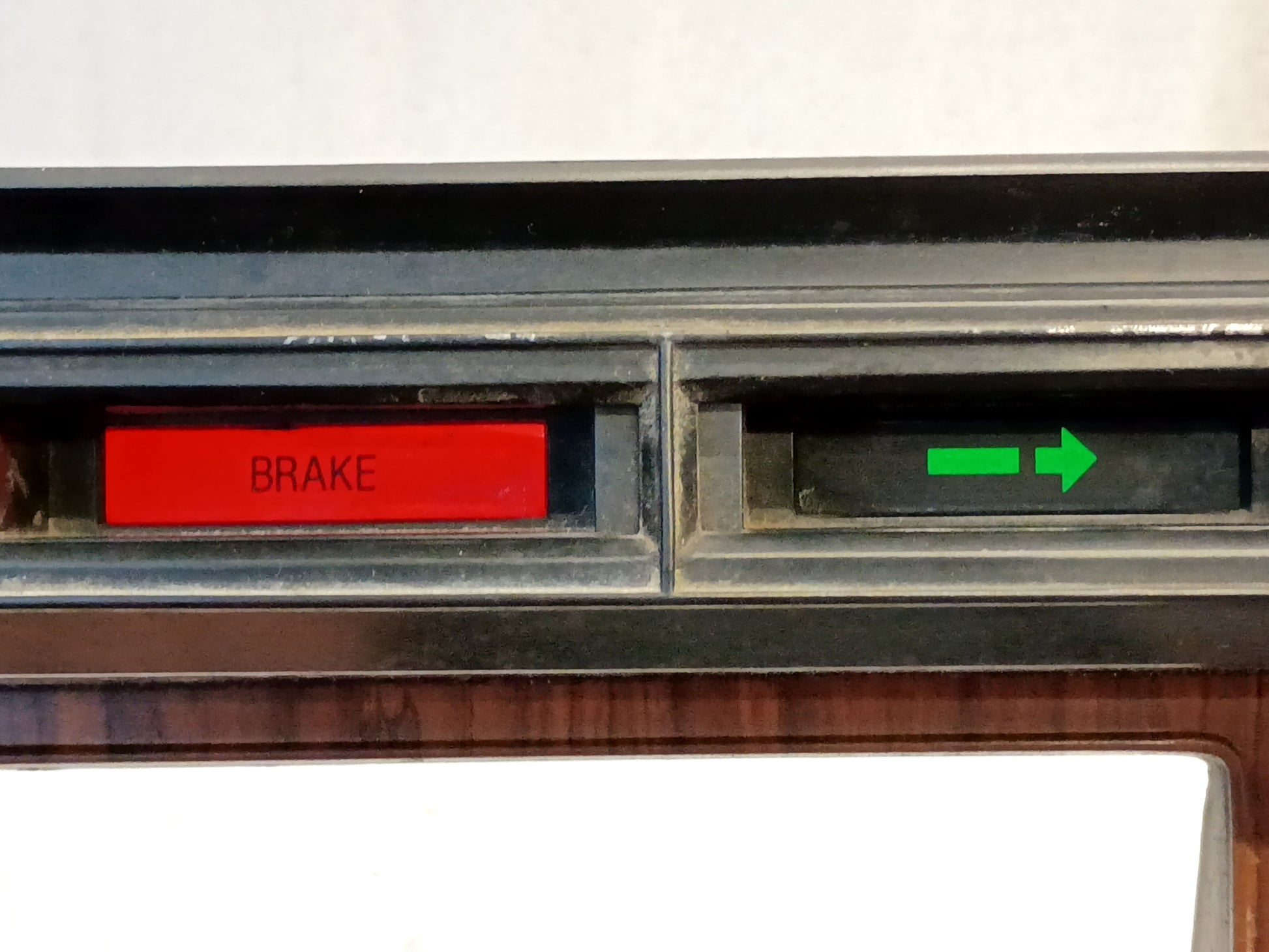 Ford F250/F350 Rose Wood gauge cluster bezel with red brake light and green arrow indicator, 1980-86 model.
