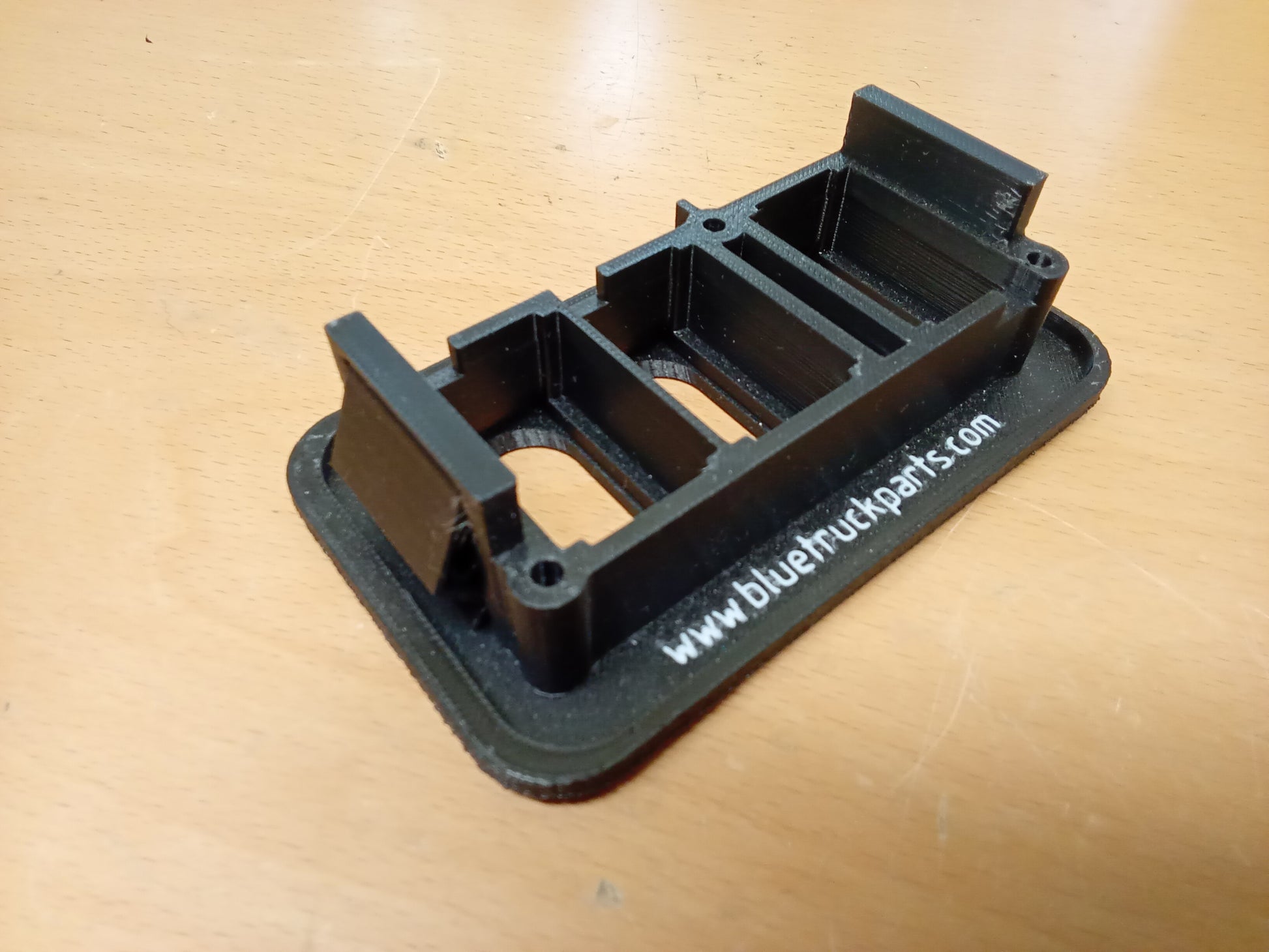 Black Ford power window and lock bezel for 1987-1991 F-150, F-250, F-350, Bronco; improved design with mounting screws.