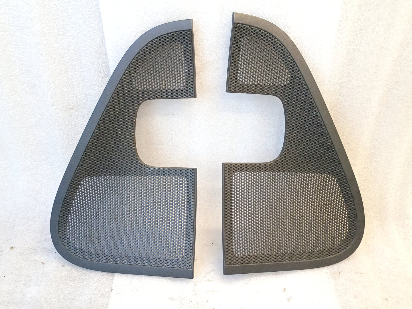Pair of dark gray speaker grill covers for 2004-2008 Ford F-150 interior door panels, left and right sides.