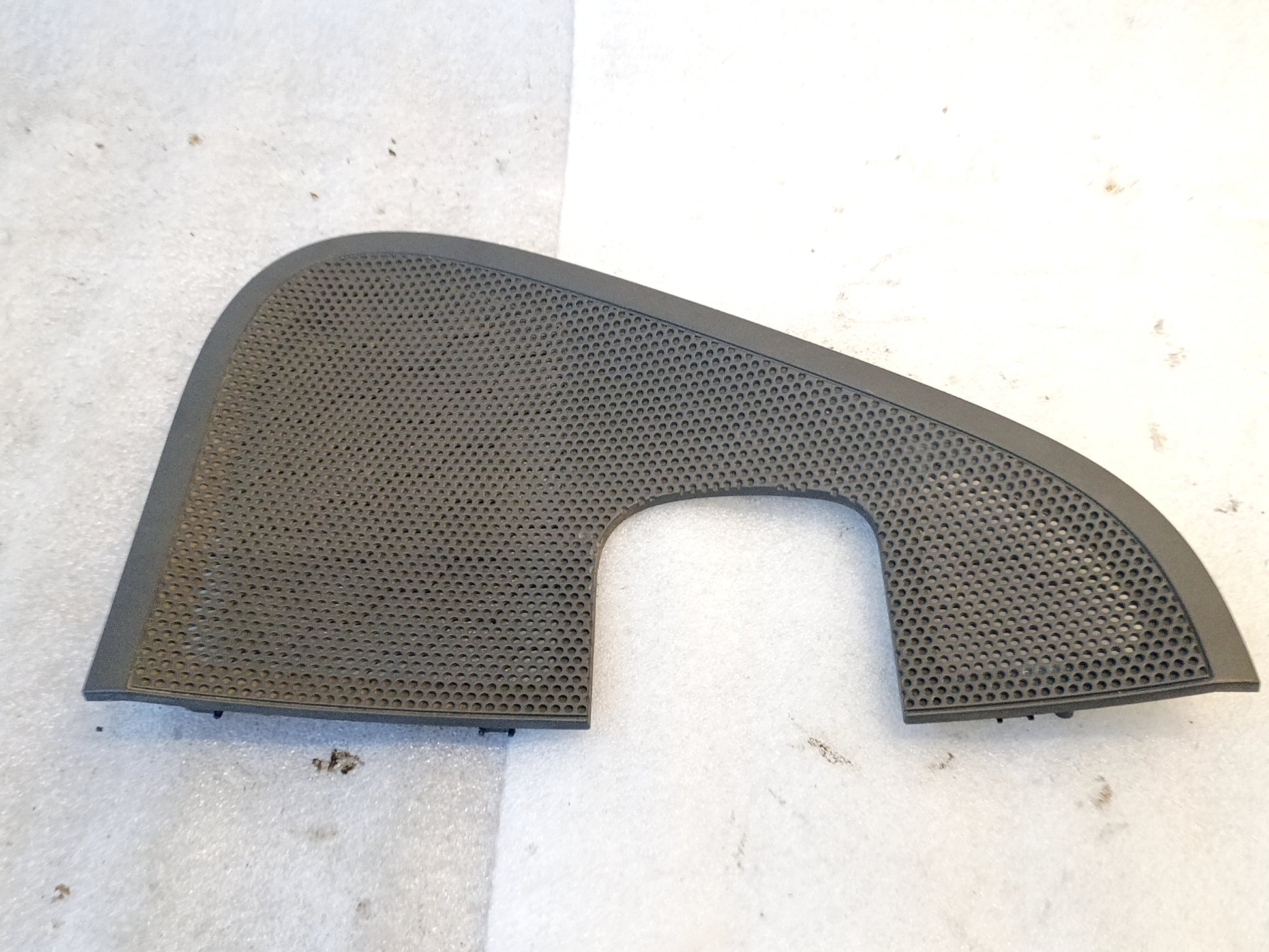 OEM Ford F-150 speaker grill cover, dark gray, perforated design, fits 2004-2008 models, mounts on interior door panel.