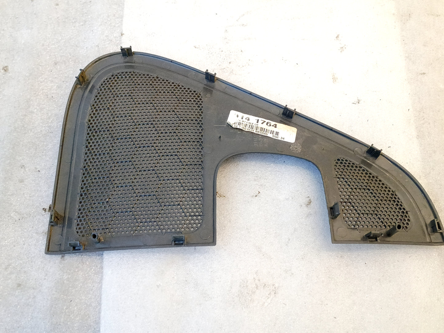 Black speaker grill cover for 2004-2008 Ford F-150, dark gray, hexagonal pattern, includes clips for mounting.