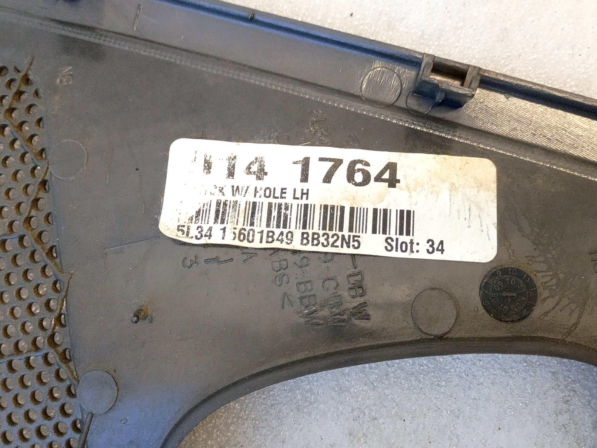 OEM Ford F-150 speaker grill cover, dark gray, with part label visible. Suitable for 2004-2008 models, set of two.