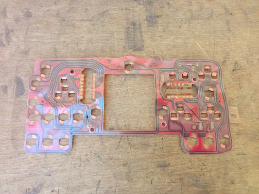 Ford instrument cluster flexible circuit board with pinkish plastic backing and copper traces, compatible with 1994 Ford F-150, F-250, F-350, and Bronco models with tachometers.