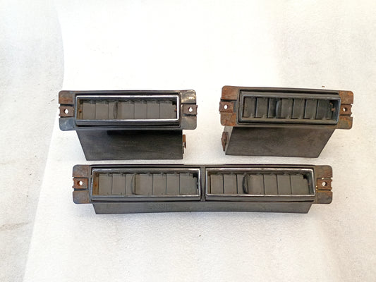 Set of three Dodge air conditioner vents for 1975-1980 D100, D150, D200, D300 models, includes two single and one double vent.