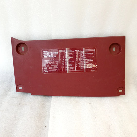 Red fuse panel cover for 1987-1991 Ford Bronco, F-150, F-250, F-350. OEM, very good condition, showing fuse identification.