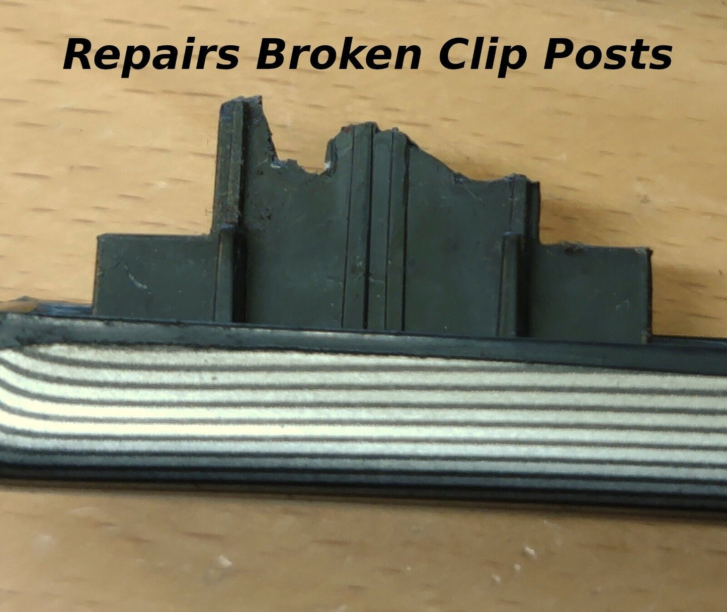 Close-up of a broken black plastic mounting post on the back of a Ford dash trim strip with text overlay stating Repairs Broken Clip Posts