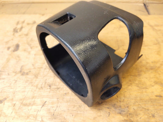 Black textured plastic non-tilt steering column shroud trim for 1992-1996 Ford F-150, F-250, F-350, and Bronco. Features molded cutouts for steering column controls.