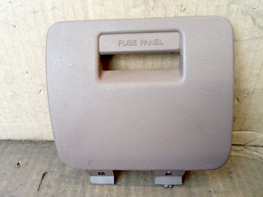 Tan/Mocha fuse panel cover for 1992-1996 Ford F-series and Bronco, mounts to the lower right dash, F2TB-1504302-AAW.