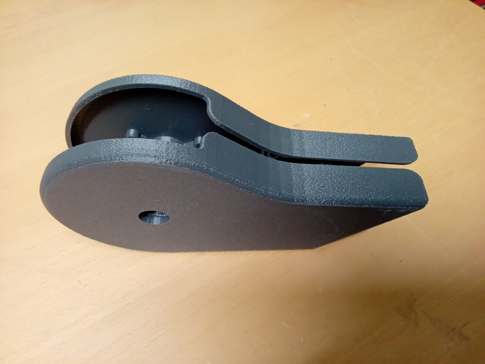 Pair of dark granite gray textured plastic split seat hinge covers for 1992-1997 Ford F150, F250, and F350 trucks, showing a rounded shape with a central mounting hole.