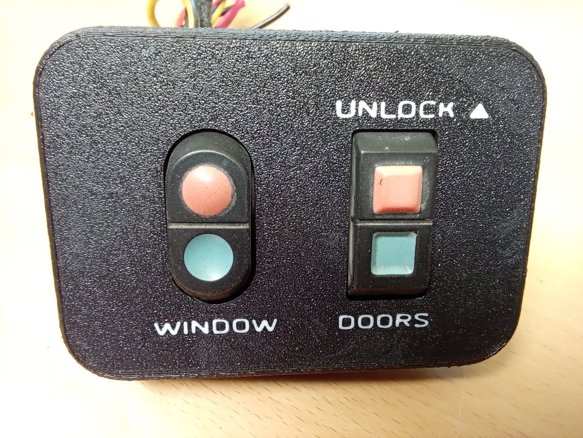 Ford power window and door lock bezel with buttons for 1987-1991 Bronco, F-150, F-250, F-350; includes "Window" and "Unlock".