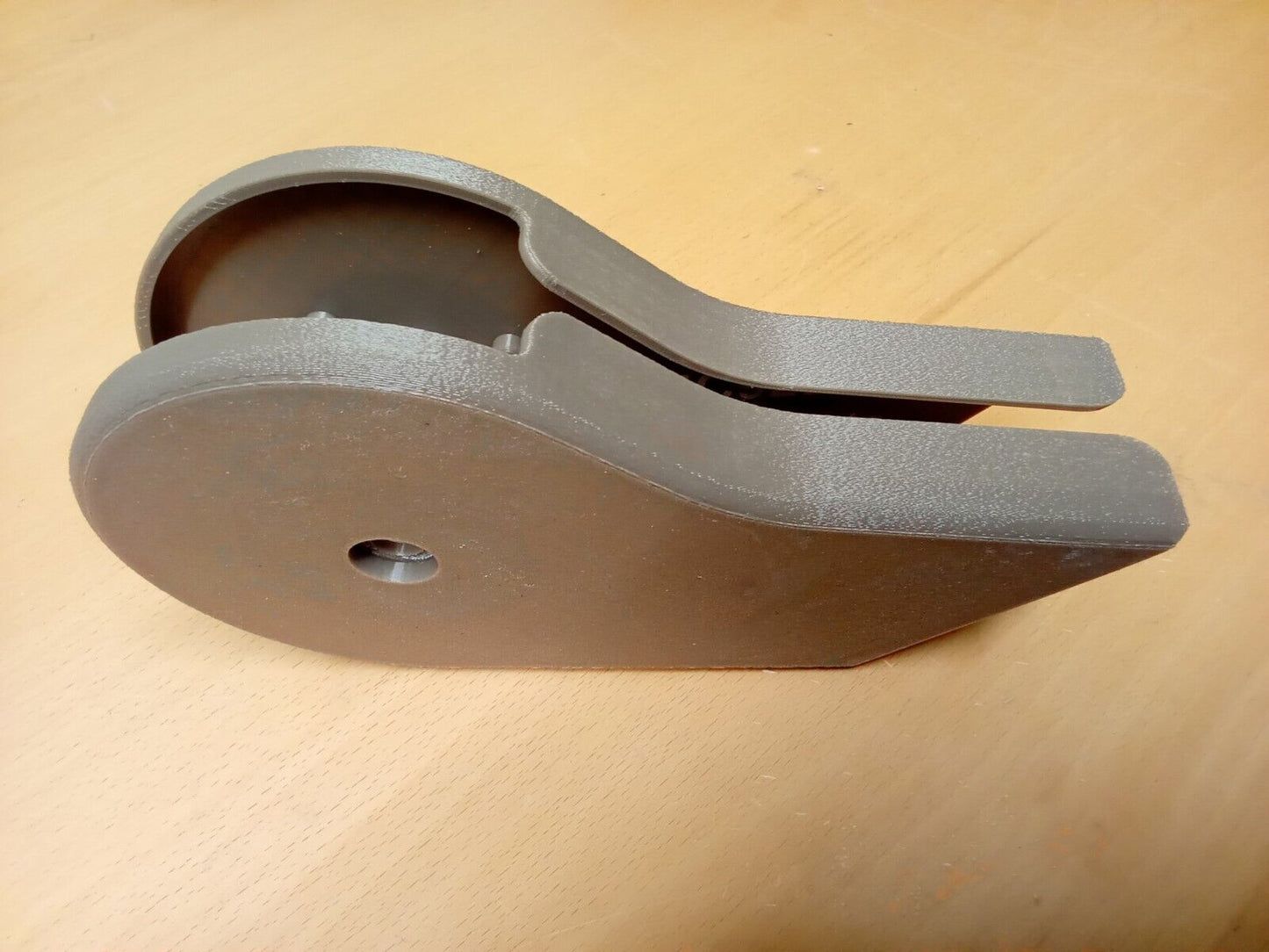 A pair of textured tan mocha split seat hinge covers for 1992-1997 Ford F150, F250, and F350 OBS trucks, nested together. The durable plastic covers feature rounded corners and a central mounting screw hole.