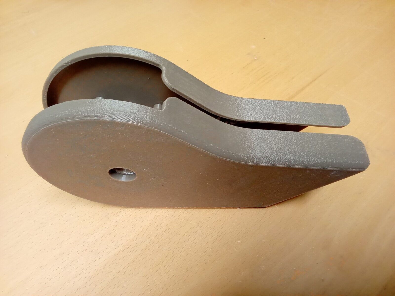 A pair of textured tan mocha split seat hinge covers for 1992-1997 Ford F150, F250, and F350 OBS trucks, nested together. The durable plastic covers feature rounded corners and a central mounting screw hole.