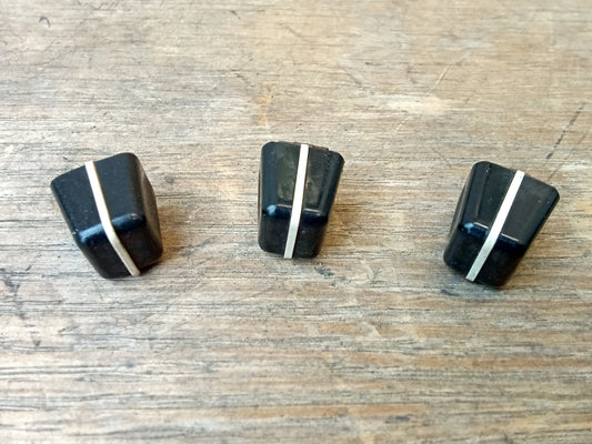 Set of three vintage OEM Ford black heater control knobs featuring a vertical white indicator line down the center, compatible with classic Ford F-150, F-250, F-350, and Bronco vehicles.